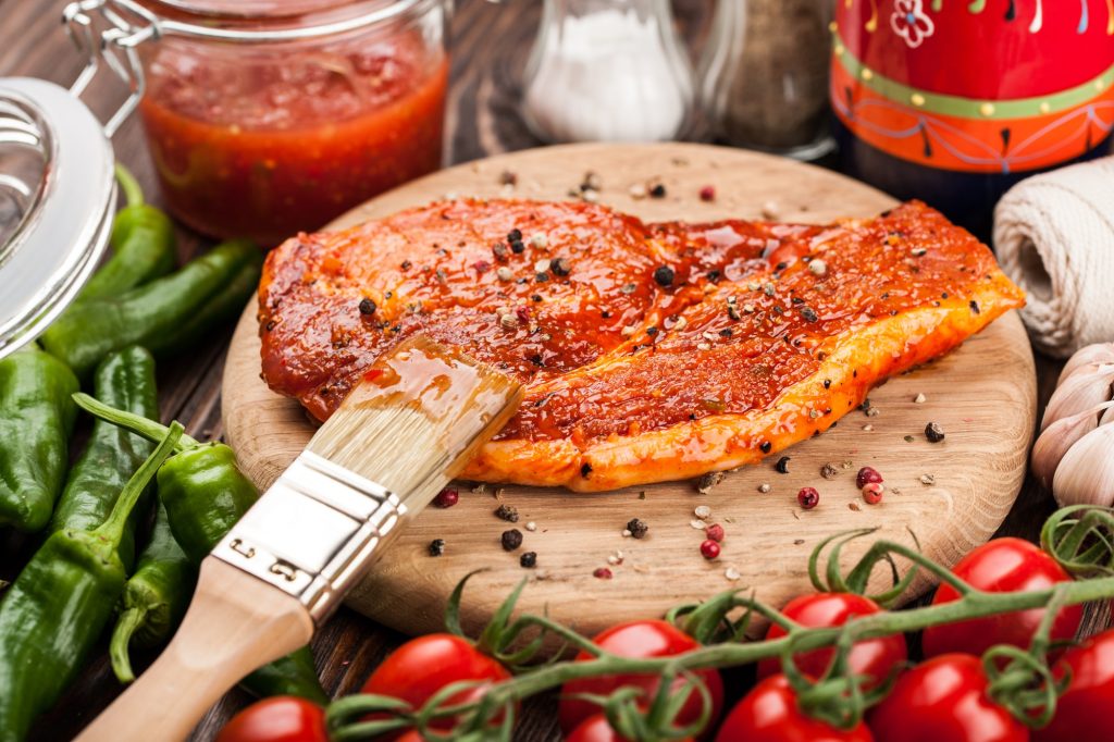 Marinating steak on a board