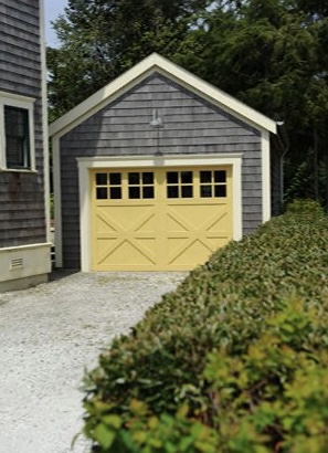 a charming yellow garage door