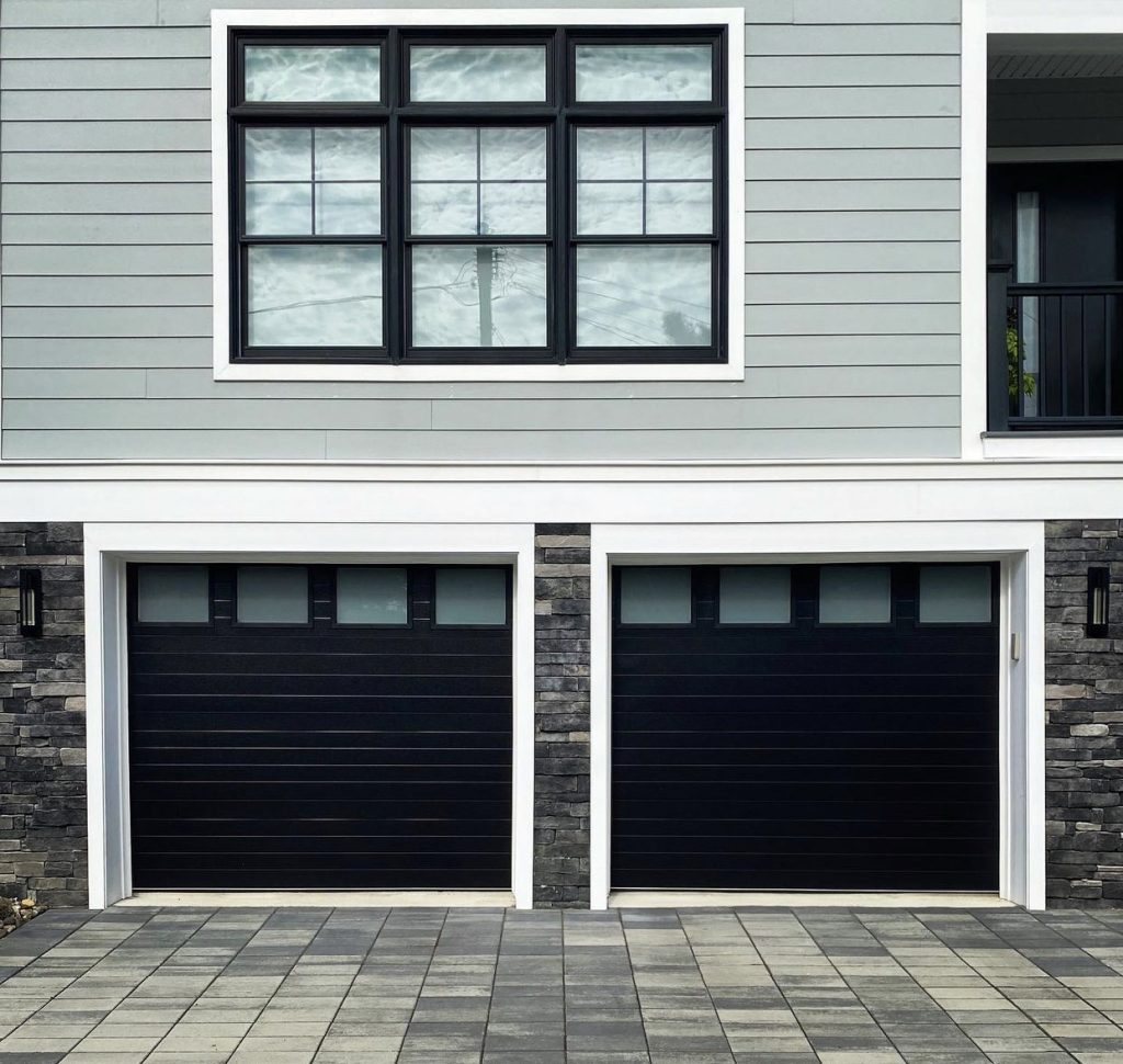 a prestigious black garage door