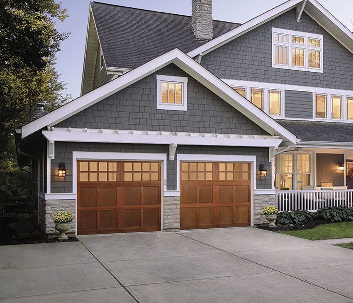 gray house brown garage door