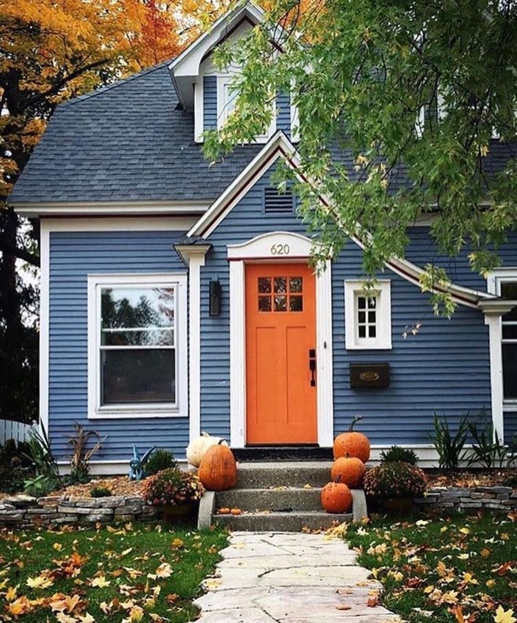 An orange white frame front door