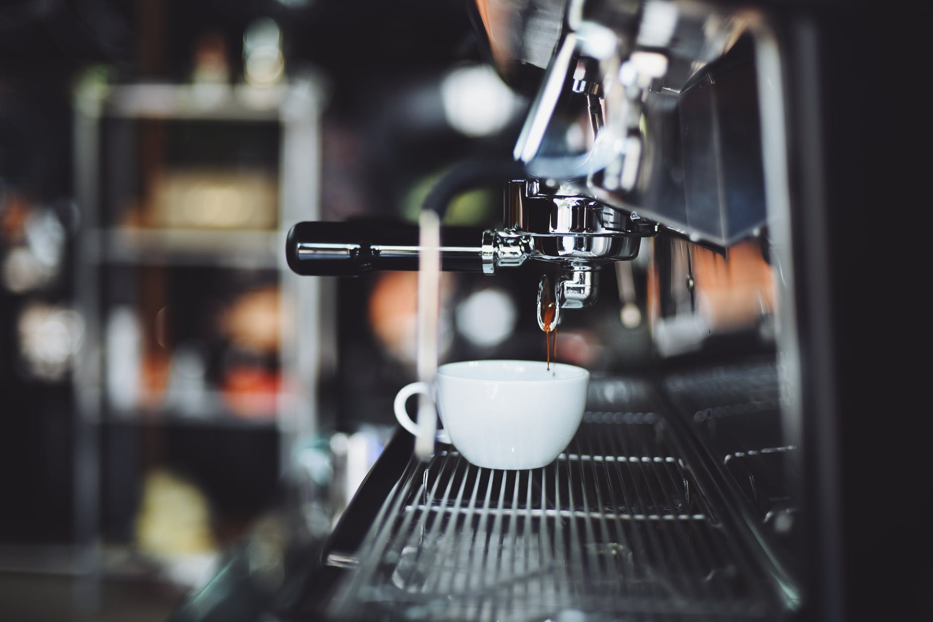 selective focus photography of espresso machine