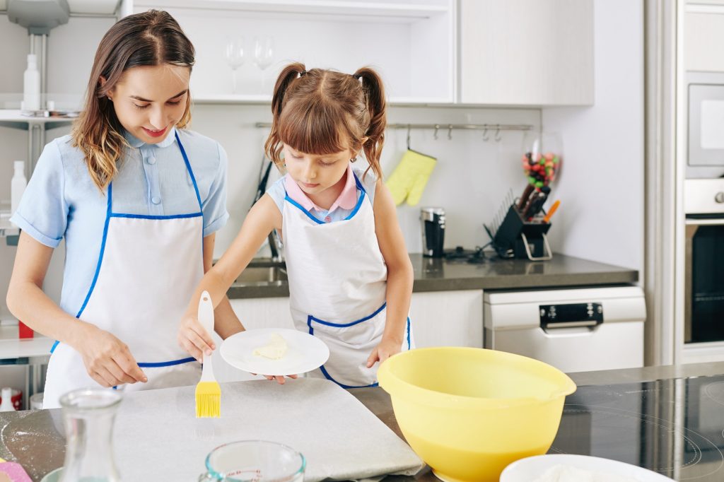 Applying butter on parchment paper